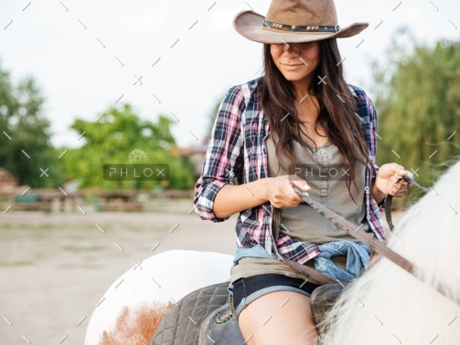 demo-attachment-19-beautiful-young-woman-cowgirl-sitting-and-riding-P3DWVG6