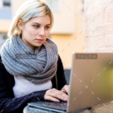 demo-attachment-40-young-focused-woman-working-on-laptop-at-outdoor-PTTFVNE